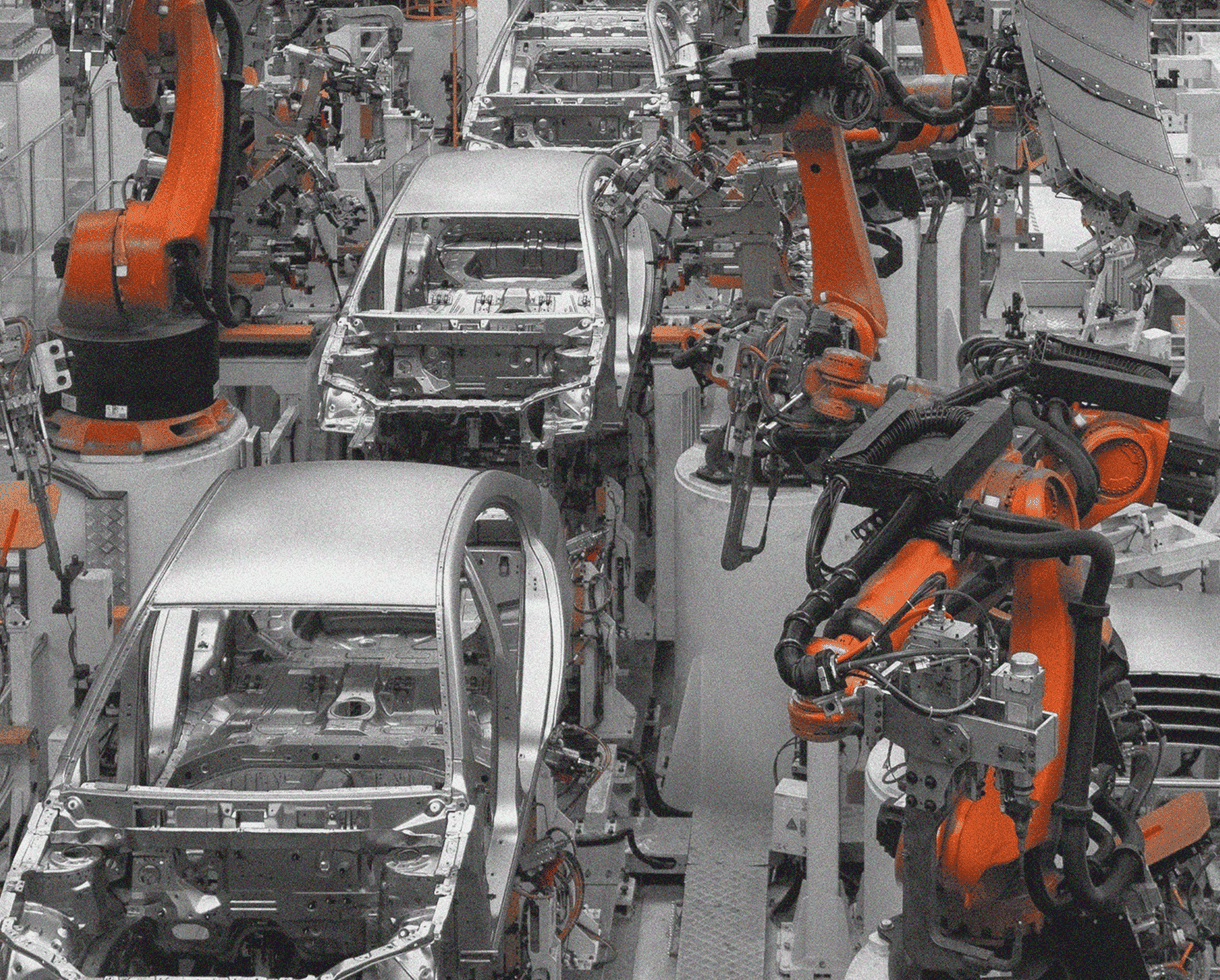 Robotic arms on an IFS-managed production line