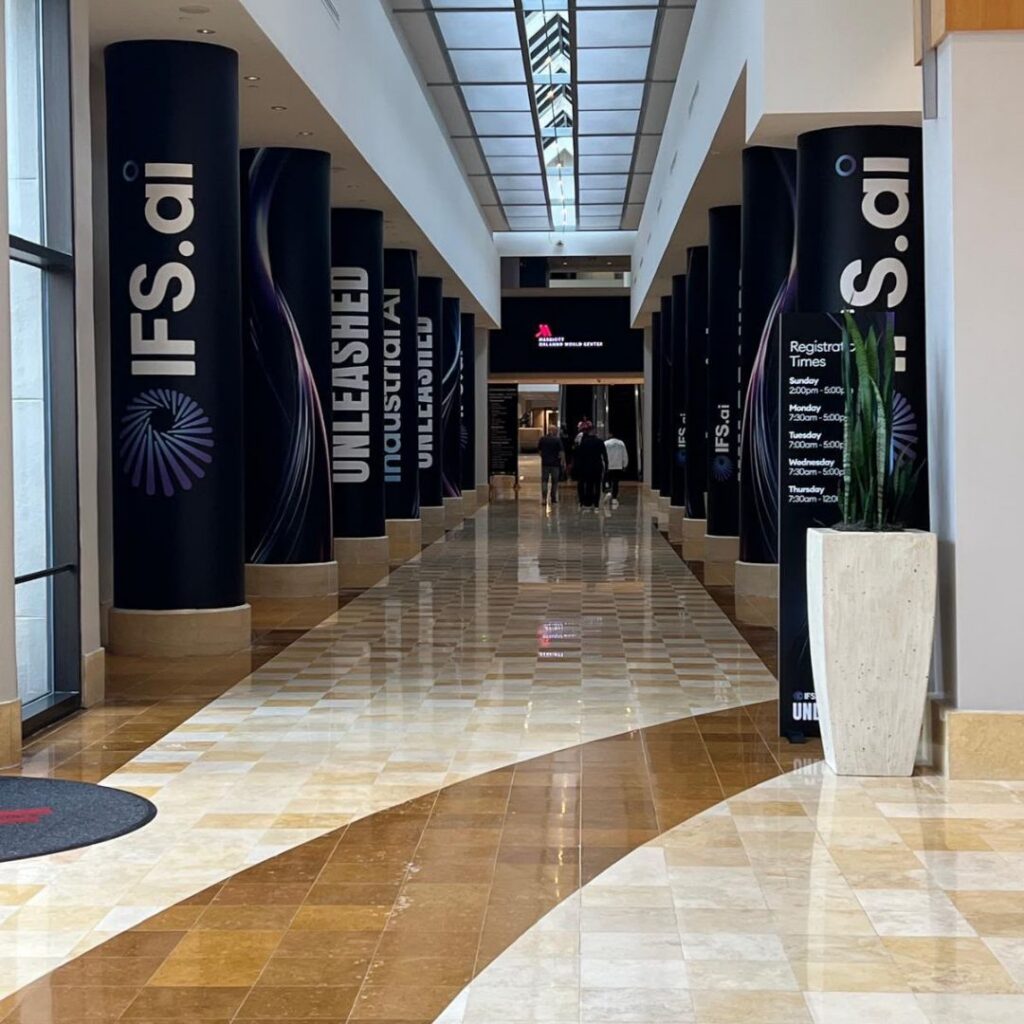 IFS Unleashed 2026 Industrial AI banners in the Orlando conference hallway